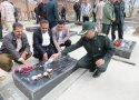 آيين احتزار پرچم و غبار روبي مزار شهيدان در بانه برگزار شد