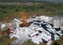 انهدام 160 هزار نخ سیگار خارجی و 1200 بطری انواع مشروبات الکلی توسط سپاه در بانه + تصاویر
